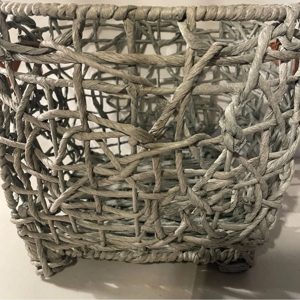 Woven gray Basket with brown Leather Handles width 14” deep 11” 4 metal feet